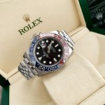 Rolex GMT-Master series, black dial, red and blue bezel, 40mm, silver five-link bracelet.