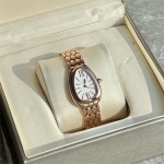 Bulgari snake watch with white dial and gold strap