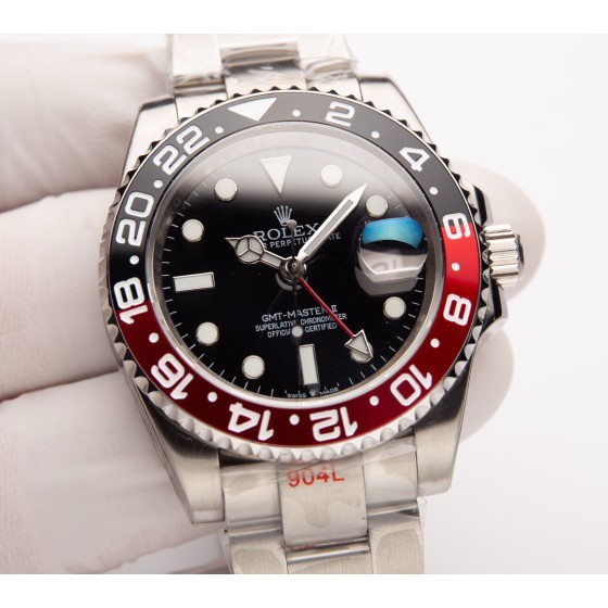 Rolex GMT-Master series, black dial, black and red bezel, 40mm, silver Oyster bracelet.
