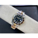 Rolex GMT-Master series, black dial, black bezel, 40mm, silver and gold Oyster bracelet.