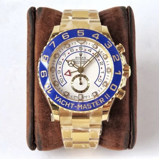 Rolex Yacht-Master series, white dial, blue bezel, gold case, 44mm, gold Oyster bracelet.