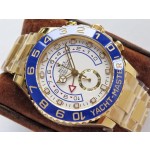 Rolex Yacht-Master series, white dial, blue bezel, gold case, 44mm, gold Oyster bracelet.
