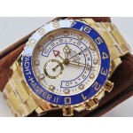 Rolex Yacht-Master series, white dial, blue bezel, gold case, 44mm, gold Oyster bracelet.