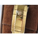 Rolex Yacht-Master series, white dial, blue bezel, gold case, 44mm, gold Oyster bracelet.