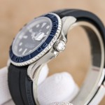 Rolex Yacht-Master series, black dial, blue bezel, silver case, 40mm, rubber strap.