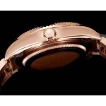 Navigator series men's watch, blue-green dial, rose gold bezel, 42mm, rose gold Oyster bracelet.