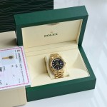Sunday calendar series men's watch, black dial, gold bezel, 40mm, gold President-style bracelet.
