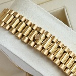 Sunday calendar series men's watch, black dial, gold bezel, 40mm, gold President-style bracelet.