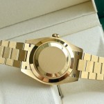 Sunday calendar series men's watch, black dial, gold bezel, 40mm, gold President-style bracelet.