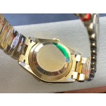 Sunday Calendar series men's and women's watches, gold dial, diamond-set bezel, 36mm and 40mm sizes, gold President-style bracelet.