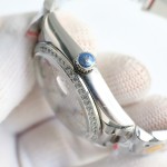 Sunday calendar series women's watch, full diamond dial, diamond-set bezel, 36mm, silver President-style bracelet.