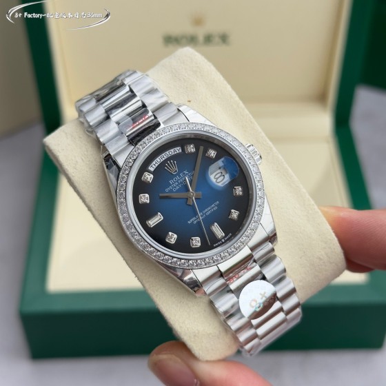 Sunday Calendar series women's watch with diamond-set gradient blue dial, diamond-set bezel, 36mm case, and silver President-style bracelet.