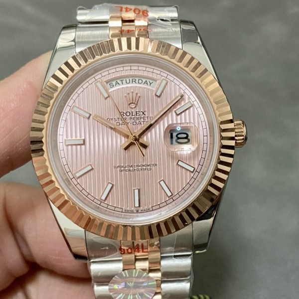 Sunday calendar series men's watch with pink dial, rose gold bezel, and 40mm two-tone five-link bracelet.