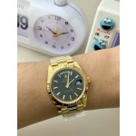 Sunday calendar series men's watch, black dial, gold bezel, 40mm, gold President-style bracelet.