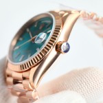 Sunday date display series women's watch, blue-green dial, rose gold bezel, 36mm, rose gold President-style bracelet.