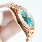 Sunday date display series women's watch, blue-green dial, rose gold bezel, 36mm, rose gold President-style bracelet.