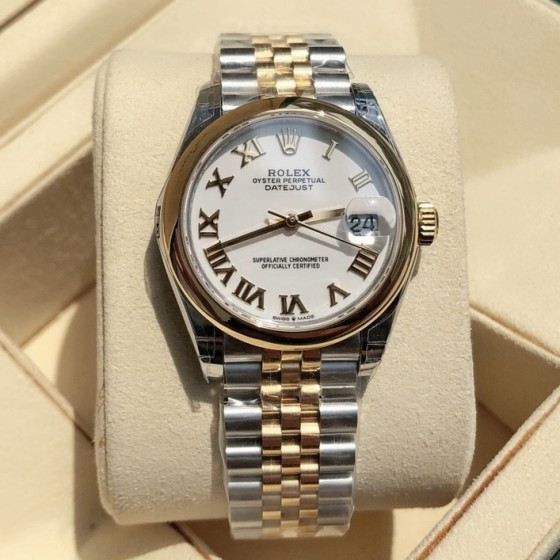 Datejust series women's watch, white dial, gold bezel, 31mm, two-tone five-link bracelet.