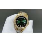 Sunday date display series women's watch, green dial, diamond-set bezel, 36mm, with diamond-set gold President-style bracelet.