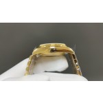 Sunday date display series women's watch, green dial, diamond-set bezel, 36mm, with diamond-set gold President-style bracelet.