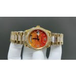 Sunday Calendar series women's watch with carnelian dial, diamond-set bezel, 36mm case, and diamond-set gold President-style bracelet.