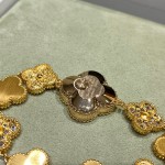 Van Cleef & Arpels watch with blue mother-of-pearl and diamond-set clover motif, featuring a blue dial.