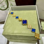 Van Cleef & Arpels watch with blue mother-of-pearl and diamond-set clover motif, featuring a blue dial.