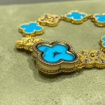 Van Cleef & Arpels watch featuring a lake-blue mother-of-pearl and diamond-set clover motif on a lake-blue dial.439
