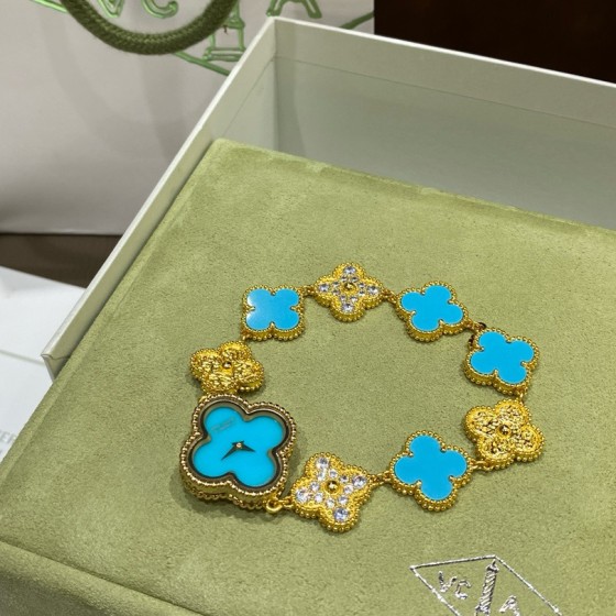 Van Cleef & Arpels watch featuring a lake-blue mother-of-pearl and diamond-set clover motif on a lake-blue dial.439