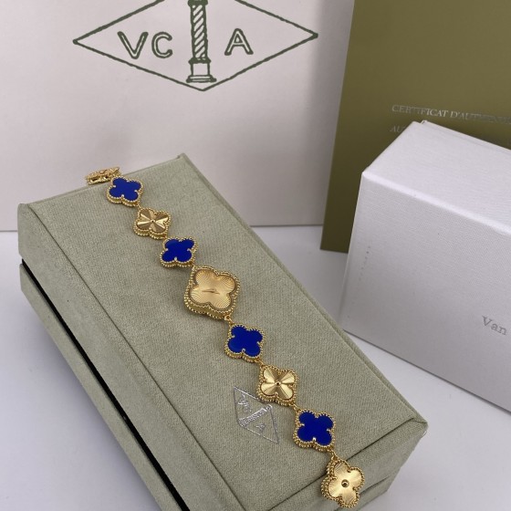 Van Cleef & Arpels watch with gold dial and blue mother-of-pearl clover motif