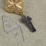 Van Cleef & Arpels watch with gold dial and blue mother-of-pearl clover motif
