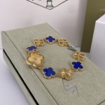 Van Cleef & Arpels watch with gold dial and blue mother-of-pearl clover motif
