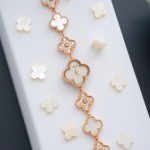 Van Cleef & Arpels watch with white mother-of-pearl and diamond-set clover dial