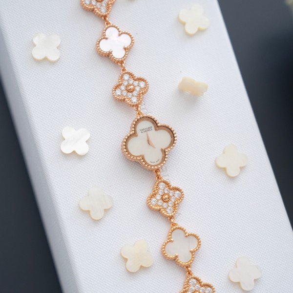 Van Cleef & Arpels watch with white mother-of-pearl and diamond-set clover dial