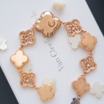 Van Cleef & Arpels watch with white mother-of-pearl and diamond-set clover dial