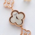 Van Cleef & Arpels watch with white mother-of-pearl and diamond-set clover dial