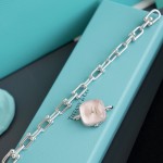 Tiffany watch with silver chain, diamond accents, and white dial