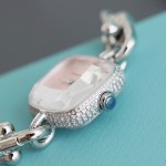 Tiffany watch with silver chain, diamond accents, and white dial