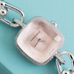 Tiffany watch with silver chain, diamond accents, and white dial