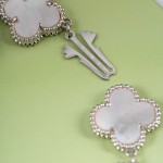 Van Cleef & Arpels watch with white mother-of-pearl clover dial