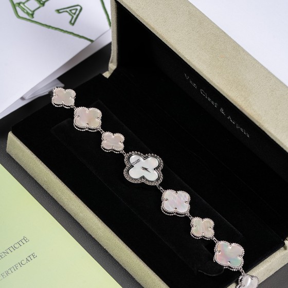 Van Cleef & Arpels watch with white mother-of-pearl clover dial