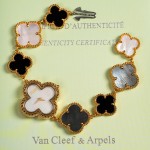 Van Cleef & Arpels Alhambra watch with white dial and black and white mother-of-pearl clover motifs