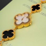 Van Cleef & Arpels Alhambra watch with white dial and black and white mother-of-pearl clover motifs