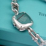 Tiffany watch with silver chain, diamond accents, and blue dial