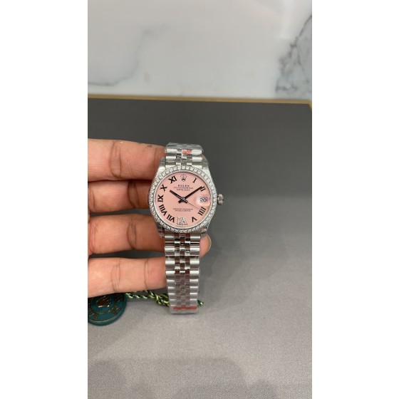 Datejust series, pink dial with diamonds, 31mm. Silver strap.