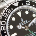 Rolex GMT-Master series, black dial, black bezel, 40mm, silver Oyster bracelet.
