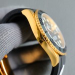 Rolex Yacht-Master series, black dial, black bezel, gold case, 40mm, rubber strap.