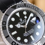 Rolex Yacht-Master series, black dial, gray bezel, silver case, 42mm, rubber strap.