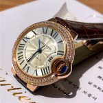 Cartier Ballon Bleu collection, 33mm ladies' watch with silver dial and diamonds, burgundy leather strap, mechanical movement.
