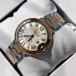 Cartier Ballon Bleu series, 33mm ladies' watch with silver dial and rose gold bezel, two-tone rose gold strap, mechanical movement.