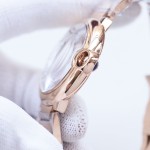 Cartier Ballon Bleu series, 33mm women's watch with silver dial, rose gold strap, quartz watch.
